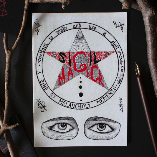 A5 sized zine titled 'SIGIL MAGICK' with a graphical design featuring a star eyes and stmbols. written and illustrated by Melancholy Memento.