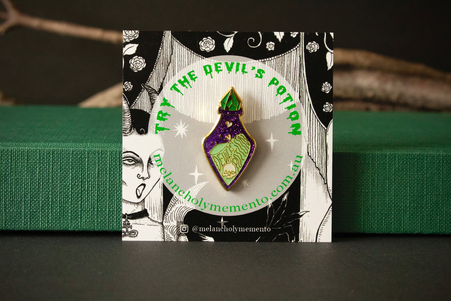 Potion bottle enamel pin on cardboard backing